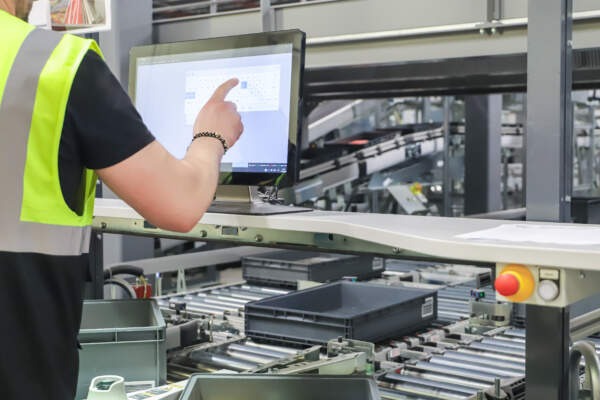 A worker at the warehouse doing the pick and pack system 